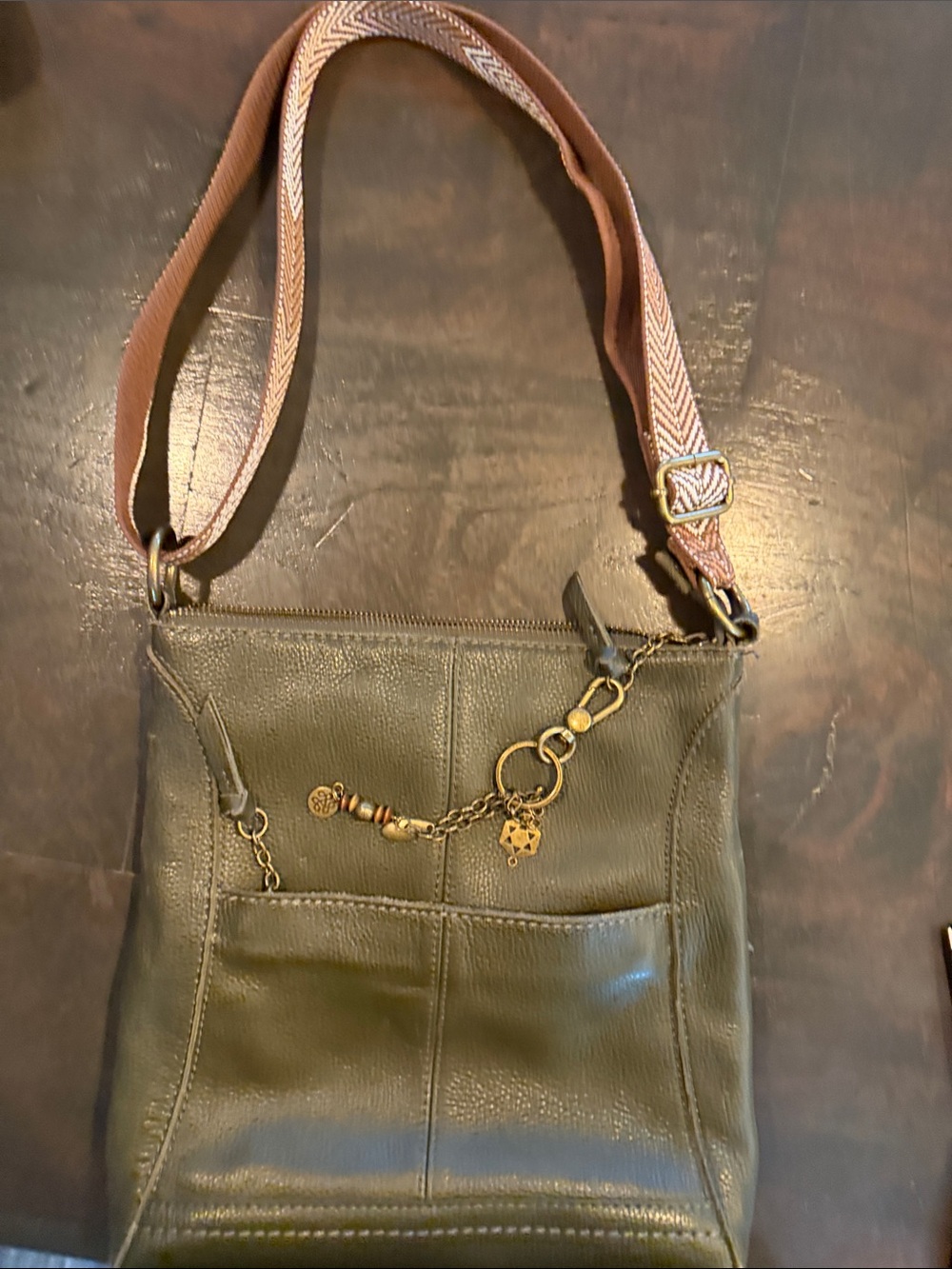 The Sak Olive Green Leather Crossbody with Decorative Charm
